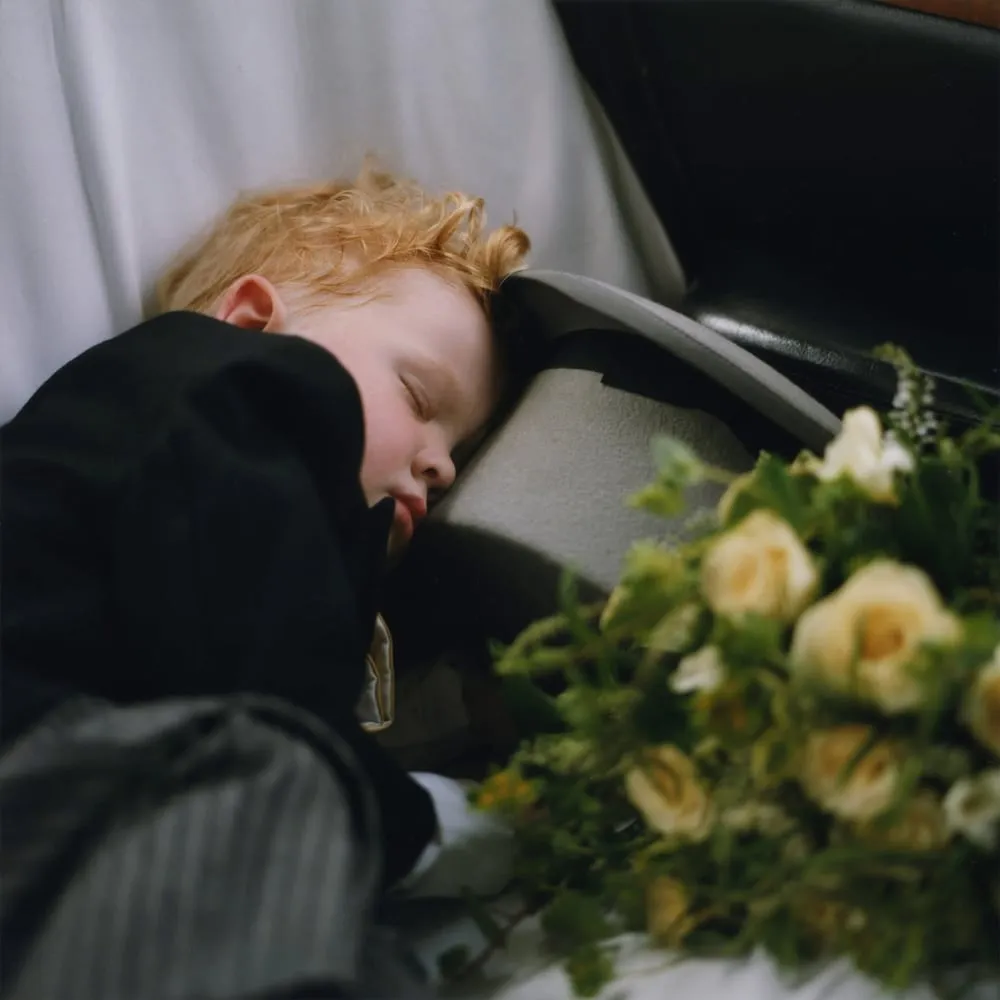 Me as a toddler, fast asleep in a car seat